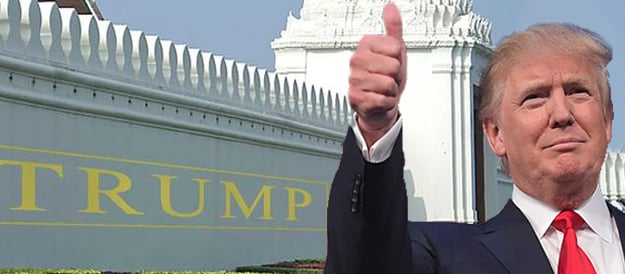 Donald Trump Putting Thumb-Up in Front of Trump Wall